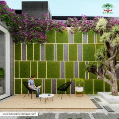 We design contemporary outdoor lounges that merge comfort with living art. This space features a custom-designed vertical moss wall with integrated backlighting, creating a stunning focal point. The composition is completed with a wooden deck, minimalist seating, and a mature specimen tree, demonstrating a harmonious blend of modern architecture and nature.