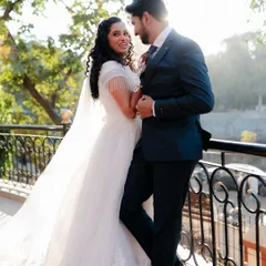 A romantic portrait of a newly married couple, basking in the golden light and their newfound happiness.