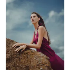 In this color version of the outdoor series, the rich magenta of the dress stands out against the earthy tones of the rock and the blue sky, creating a powerful visual contrast.