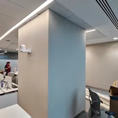 Here, I used a gripper system to wrap an office pillar in neutral-toned acoustic fabric. This technique ensures a clean, seamless finish with no visible edges, blending perfectly with the office decor.