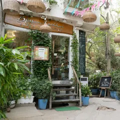 Step into nature. Surrounded by lush plants and natural decor, our salon entrance promises a tranquil experience from the moment you arrive.
