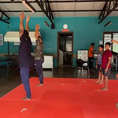 We teach students of all ages the benefits of yoga. Here, both young and adult members of our SSKKA family practice balancing postures, demonstrating that the journey of physical and mental wellness has no age limit.