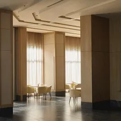 The banquet space is defined by large columns and expansive windows, creating a grand yet inviting atmosphere for events.