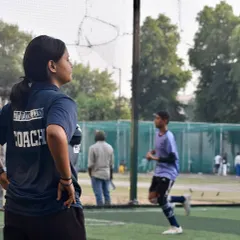 A female coach observes players during the Delhi Youth League trials. I ensure my events are run by experienced and professional coaching staff to properly evaluate talent.