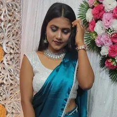A perfect party look. I created a smokey eye with a bold lip, paired with oxidized silver jewelry, which looks stunning with her satin blue saree.