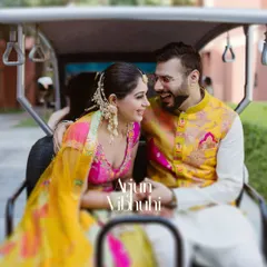 A joyful, candid shot of a couple sharing a laugh in a golf cart during their Haldi celebrations in Jaipur. These are the real, unposed moments I love to capture.