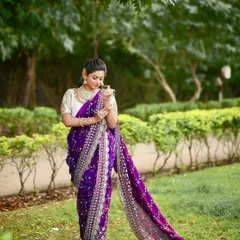 The full view of this stunning purple Nauvari, showcasing its elegant drape and detailed silver embroidery, ideal for a Diwali party.