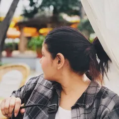 A candid moment, feeling the relaxed aesthetic of a K-drama hero. The simple combination of a plaid shirt over a white tee is a go-to for an easy, thoughtful look, perfect for a quiet afternoon at a cafe.