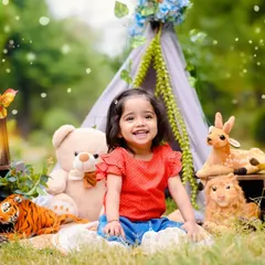 Celebrating a second birthday with a smile that lights up the whole park. My outdoor milestone sessions use natural light and fun setups like this animal-themed teepee to capture your child's personality.