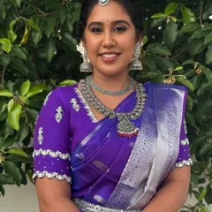 A full-length view of Dr. Indhu's "Silver Bride" look. The oxidized silver jewellery, including the necklace, earrings, and oddiyanam (waist belt), creates a unique and modern ethnic statement.