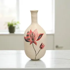 I shape and paint each ceramic vase by hand, making every piece one-of-a-kind. This vase, with its intricate red and black lotus design, brings a timeless warmth and artistry to any space, whether holding fresh flowers or standing alone.