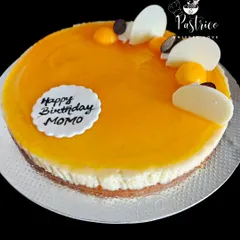 A classic baked New York cheesecake with a delicious mango compote topping, perfect for a summer birthday.