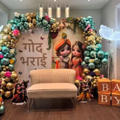 A beautiful Godh Bharai ceremony with a Krishna and Radha theme. The vibrant balloon arch, neon butterfly lights, and character cutouts make for a modern yet traditional celebration for the mom-to-be.