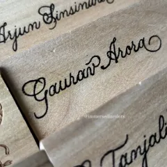 The beauty of hand-lettering is that every name has its own unique flow and character. This close-up shows the detail in the script for these custom nameplates.