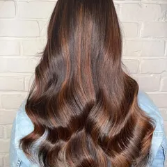 A beautiful example of a copper and golden brown balayage. I hand-painted these highlights to create a warm, dimensional effect that shines from every angle, styled here with soft waves.