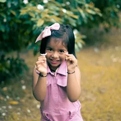 Capturing the pure, unscripted joy of childhood is what I love most. This candid portrait of my niece in the park shows the authentic, heartwarming energy I bring to family and kids' photoshoots.