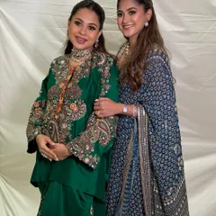 The two beautiful sisters together, one celebrating her baby shower. Their complementary makeup looks are elegant and timeless.