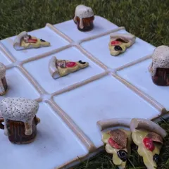 A playful and creative masterpiece by our student Sejal. This ceramic tic-tac-toe set, with its pizza and beer mug game pieces, shows how you can turn everyday objects into functional art in our foundation course.