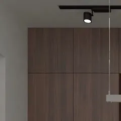 Another angle of the dark kitchen concept, emphasizing the seamless integration of the cabinetry. The design plays with light and shadow to create a moody yet functional culinary space.