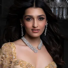 Another beautiful shot from the Mehta Emporium campaign. This close-up shows the clean makeup and dramatic winged eyeliner, a timeless look that ensures the focus remains on the exquisite diamond jewelry.