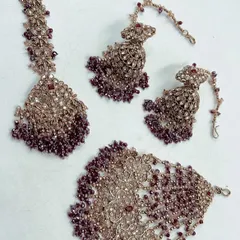 The same mehndi set design in a deep wine color, offering a more dramatic look for your pre-wedding events.