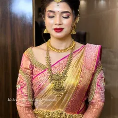 A classic bridal look featuring a bold red lip and soft gold eyeshadow. This timeless combination is perfect for a traditional wedding ceremony.