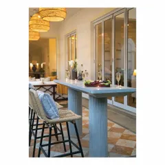 A cast in-situ bar table in grey concrete sets the mood for this verandah sit-out. Paired with cane chairs and matching hanging lights, it becomes a relaxed and stylish spot for enjoying the tropical evenings by the pool.