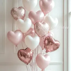 A romantic bouquet of heart-shaped balloons. I used a mix of matte white, pearl pink, and rose gold foil heart balloons for this arrangement.