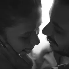 An intensely intimate black and white close-up. We focus on the gentle touch and raw emotion to create powerful pre-wedding moments that feel deeply personal and artistic.