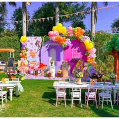 A wide view of the Fairyland party, showing the main backdrop, kids' dining tables, and a custom balloon tree. This demonstrates how I style an entire space to create a complete, immersive world.