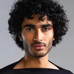 An example of our men's grooming services for a fashion lookbook. We focused on achieving a clean, even skin tone while defining the model's natural hair texture for a sharp, camera-ready finish.