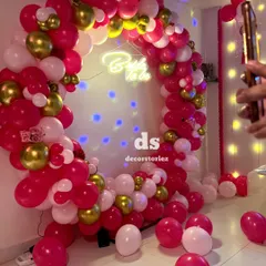 A behind-the-scenes look at our 'Bride to be' ring decoration. The setup includes a projector casting light spots, adding a dreamy effect to the pink and gold balloon arrangement.