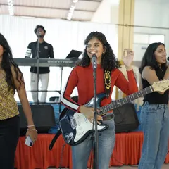 That awkward smile when you mess up the lyrics but your bandmates have your back. Live music is beautifully imperfect.