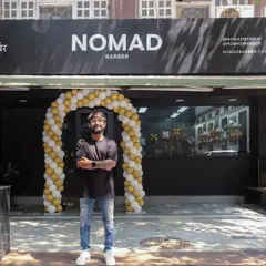 Proudly standing outside my dream come true, Nomad Barber Mumbai. It was a crazy journey to build this place, and I'm excited to welcome you here.