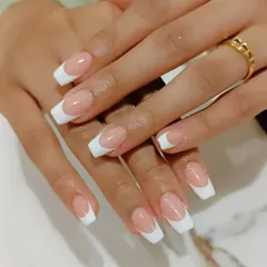 Another look at our classic French manicure, showcasing the clean look and expert shaping on these coffin nail extensions.