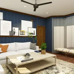 Another angle of the moody blue entertainment room, showing the large sectional sofa and the bay window with additional seating. It's a versatile space designed for gathering with family and friends.