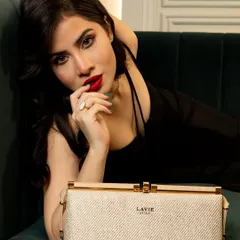 A close-up from the Lavie campaign, where the composition draws the eye directly to the product. The model's expression adds a layer of allure and sophistication.