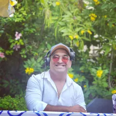 A happy moment captured during a daytime garden party. I am an approachable and friendly professional who loves to connect with clients and guests.