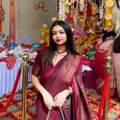 For me, festive dressing is all about embracing our traditions. Here I am, soaking in the Durga Puja vibes in a classic maroon cotton Benarasi saree, showing how traditional wear can be both elegant and powerful.