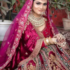 This bride is wearing a deep magenta velvet lehenga. I created a soft, glowing makeup look to complement the richness of the fabric and the heavy jewelry.