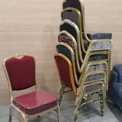 Our banquet chairs are designed to be stackable, making them easy to store and manage for large venues. This image shows a stack of chairs with different fabric patterns, ready for the next event.