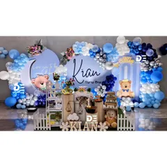 Another angle of Kian's teddy bear party, showing the full stage with its white picket fence and charming props.