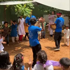 Children and instructors dance together to the beat of the parai drum during our Independence Day celebration, sharing in the joy of folk music and community.