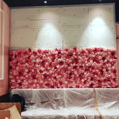 This is an artificial pink rose flower wall I was setting up for an event. These make for a very popular photo backdrop at weddings, birthday parties, and bridal showers.