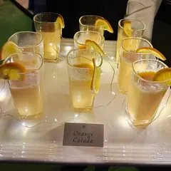Our refreshing Orange Colada mocktails served on an illuminated tray. We pay attention to presentation to ensure our beverages look as good as they taste.