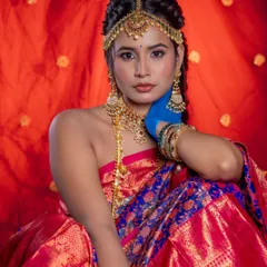 This portrait showcases the front view of the hairstyle, with the maang tikka perfectly integrated into the look.
