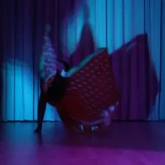 The blur of a spin during a solo practice session. This is where I lose myself in the flow and find new expressions, turning feelings into movement.