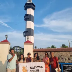 Posing with our banner at the old lighthouse on Promenade Beach. It's a great spot to learn about the town's maritime history.