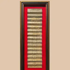 This antique Pattachitra scroll is given new life within a custom frame. The double frame moulding, combining an antique gold box with a two-toned brown and gold outer frame, creates a regal presentation.