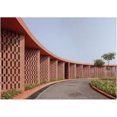 The curved brick jali wall at the Dr. Vishnuvardhan Memorial is a key element of the design. It creates a semi-permeable screen that filters light and air, forming shaded, in-between spaces for people to gather, reflecting my goal to design for community interaction.